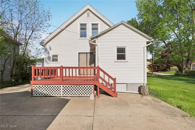 1540 Grand Park Ave, Akron, OH 44310 - rear view of property with a lawn and a wooden deck