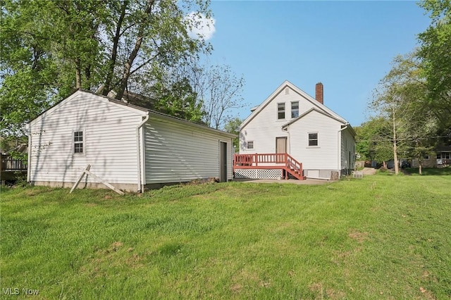 1540 Grand Park Ave, Akron, OH 44310 - back of house with a deck, a yard, and a chimney