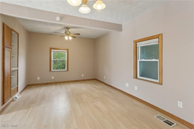 1540 Grand Park Ave, Akron, OH 44310 - empty room featuring light wood-style flooring, ceiling fan, a chandelier, baseboards, and a textured ceiling