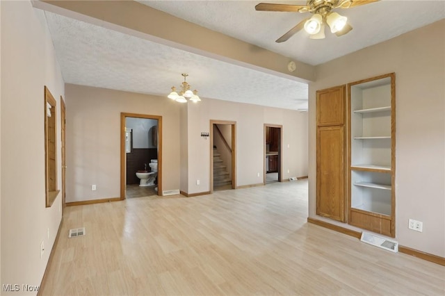 1540 Grand Park Ave, Akron, OH 44310 - empty room featuring stairs, light wood finished floors, ceiling fan, and baseboards