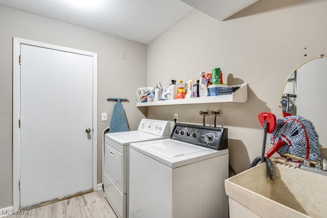 9942 Pebble Beach Cv, Reminderville, OH 44202 - laundry room with separate washer and dryer and light wood finished floors