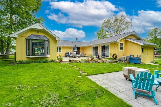 9942 Pebble Beach Cv, Reminderville, OH 44202 - back of house featuring a patio and a yard