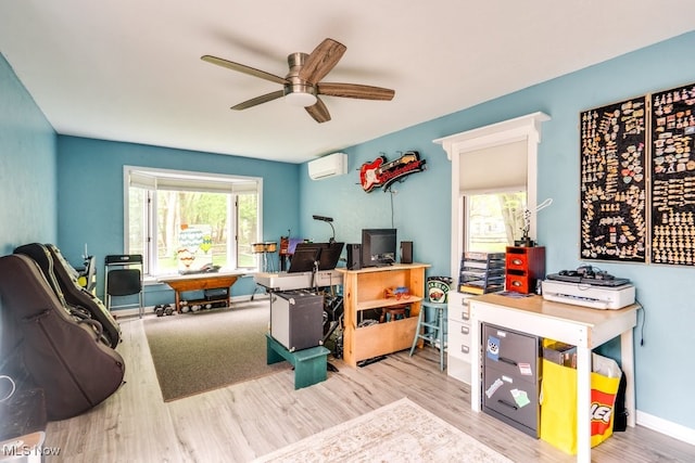 9942 Pebble Beach Cv, Reminderville, OH 44202 - recreation room featuring a wall mounted AC, wood finished floors, a ceiling fan, and baseboards
