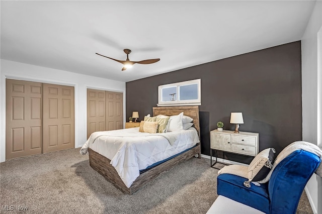 2162 Daniels Ave, Akron, OH 44312 - carpeted bedroom featuring two closets and ceiling fan