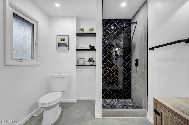 2162 Daniels Ave, Akron, OH 44312 - full bath featuring tiled shower, toilet, tile patterned floors, baseboards, and recessed lighting
