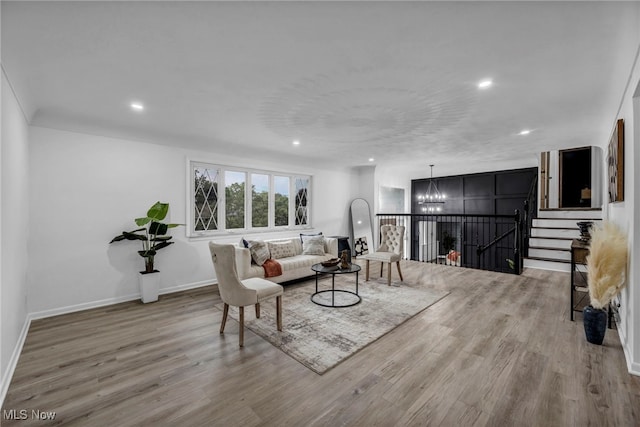 2162 Daniels Ave, Akron, OH 44312 - living room featuring a chandelier, wood finished floors, recessed lighting, and baseboards