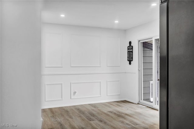 2162 Daniels Ave, Akron, OH 44312 - spare room with wood finished floors and recessed lighting
