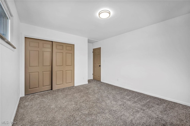 2162 Daniels Ave, Akron, OH 44312 - unfurnished bedroom with carpet, a closet, and baseboards