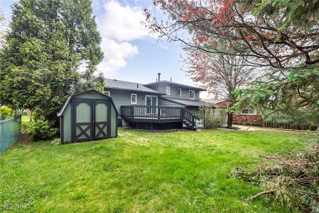 2162 Daniels Ave, Akron, OH 44312 - back of property featuring a storage shed, a deck, an outbuilding, and a shingled roof