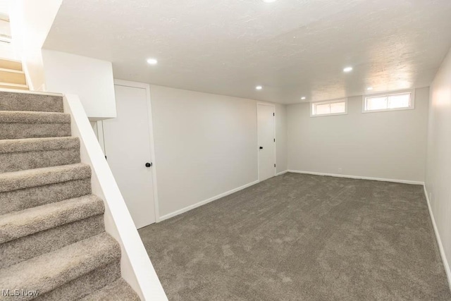 basement featuring stairway, recessed lighting, carpet flooring, and baseboards