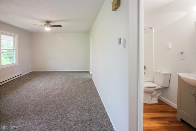 1335 Avalon Dr, Madison, OH 44057 - unfurnished room featuring a baseboard heating unit, ceiling fan, and baseboards