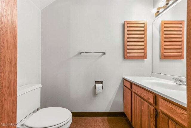2889 Charing Cross Rd NW, Canton, OH 44708 - half bath with toilet, vanity, and baseboards