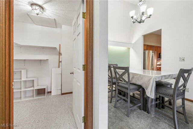2889 Charing Cross Rd NW, Canton, OH 44708 - carpeted dining space featuring a chandelier and baseboards