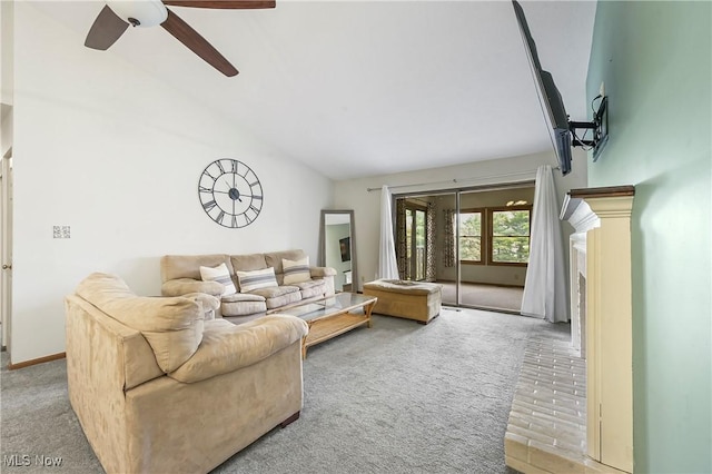 2889 Charing Cross Rd NW, Canton, OH 44708 - living area with light carpet, vaulted ceiling, ceiling fan, and a fireplace