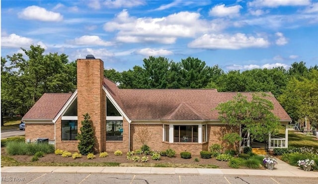 2889 Charing Cross Rd NW, Canton, OH 44708 - view of front facade featuring a chimney and brick siding