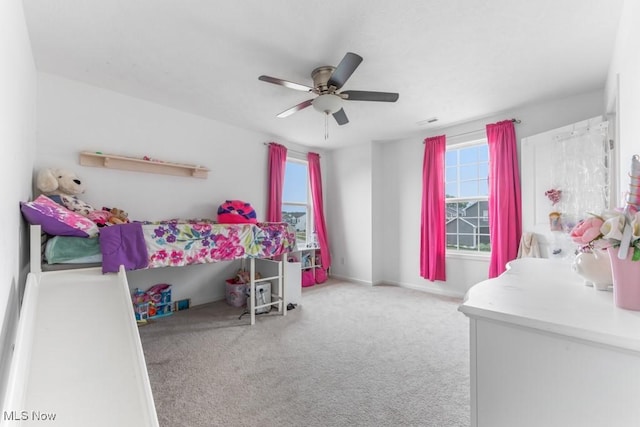 1726 Cobham Ln, Wadsworth, OH 44281 - bedroom featuring multiple windows, carpet flooring, a ceiling fan, and baseboards