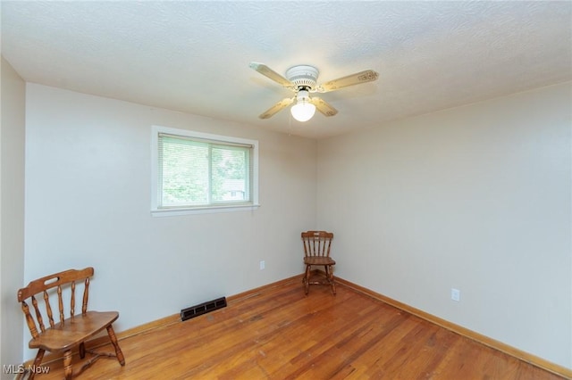 347 Beeler Dr, Berea, OH 44017 - sitting room with light wood finished floors, ceiling fan, and baseboards