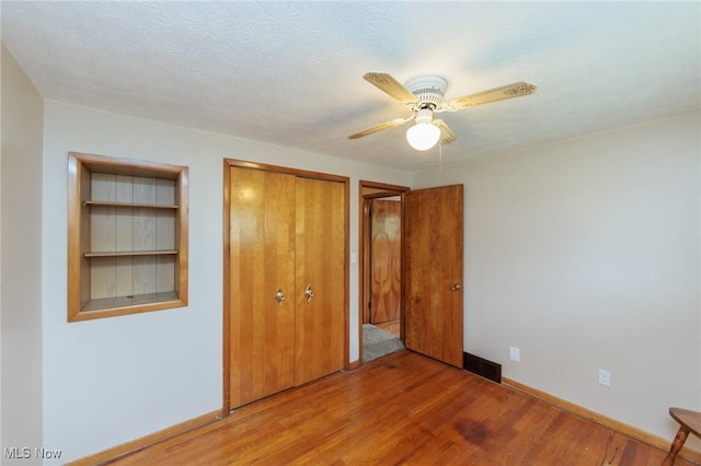 347 Beeler Dr, Berea, OH 44017 - unfurnished bedroom with light wood-style floors, a closet, baseboards, and ceiling fan