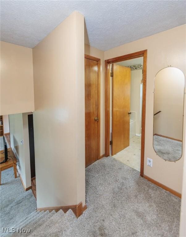 347 Beeler Dr, Berea, OH 44017 - corridor featuring carpet, a textured ceiling, and baseboards