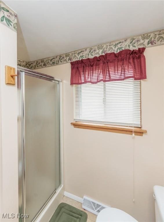 347 Beeler Dr, Berea, OH 44017 - bathroom featuring toilet, a stall shower, tile patterned flooring, and baseboards