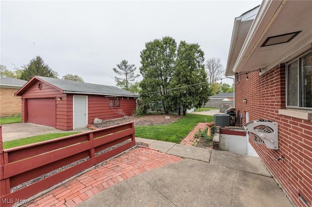 347 Beeler Dr, Berea, OH 44017 - view of patio featuring an outdoor structure, a garage, fence, and cooling unit