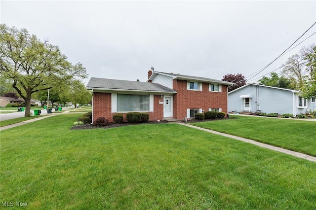 347 Beeler Dr, Berea, OH 44017 - tri-level home featuring brick siding and a front lawn
