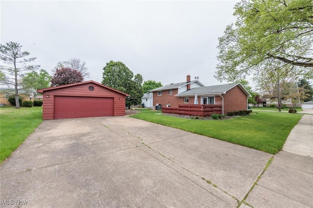 347 Beeler Dr, Berea, OH 44017 - view of side of home featuring an outdoor structure, a lawn, brick siding, a garage, and a wooden deck