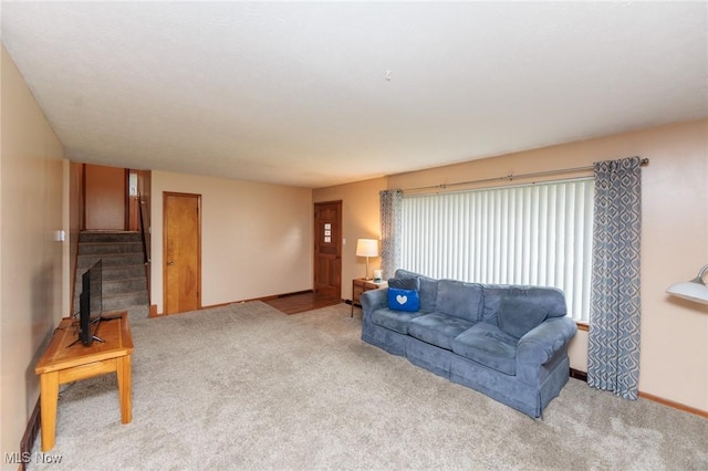347 Beeler Dr, Berea, OH 44017 - carpeted living area with baseboards and stairs