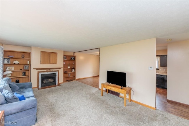 347 Beeler Dr, Berea, OH 44017 - living room featuring light carpet, a fireplace, and baseboards
