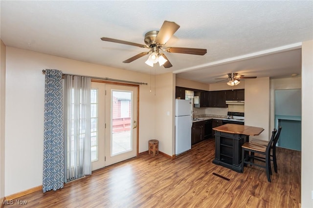 347 Beeler Dr, Berea, OH 44017 - kitchen with freestanding refrigerator, electric range, ceiling fan, and wood finished floors