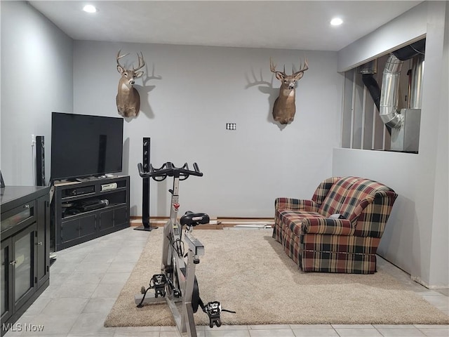 exercise area featuring recessed lighting, light tile patterned flooring, and baseboards