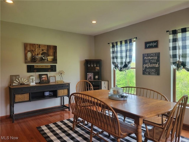 dining room with recessed lighting, wood finished floors, and baseboards