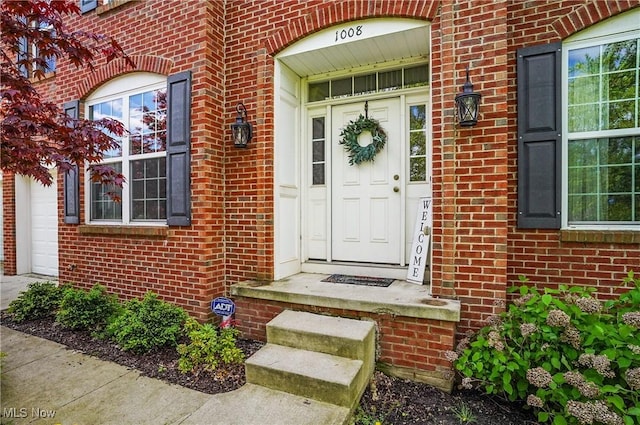 property entrance with brick siding