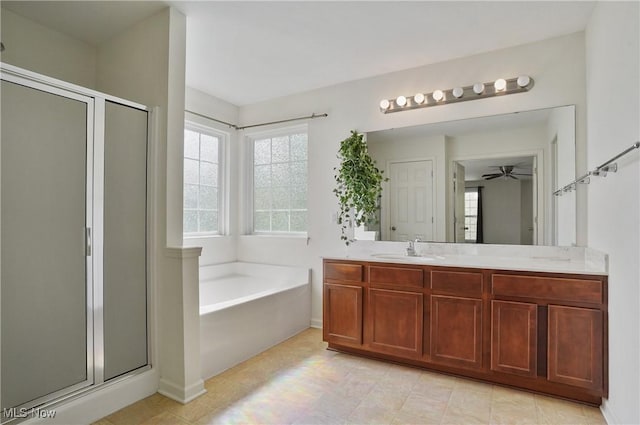 bathroom with a shower stall, a bath, vanity, and ceiling fan