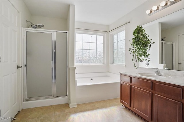 full bath with a shower stall, a garden tub, and vanity
