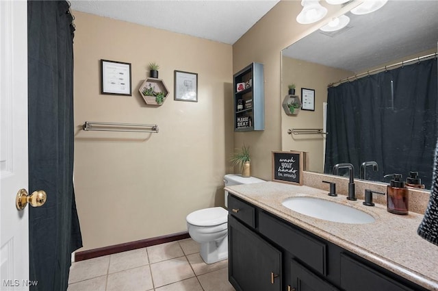 16538 S White Oaks Dr, Strongsville, OH 44136 - bathroom featuring tile patterned floors, toilet, vanity, and baseboards