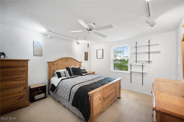 16538 S White Oaks Dr, Strongsville, OH 44136 - bedroom featuring track lighting, light carpet, and a ceiling fan
