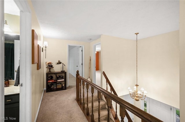 16538 S White Oaks Dr, Strongsville, OH 44136 - hall with a chandelier, light colored carpet, an upstairs landing, and baseboards