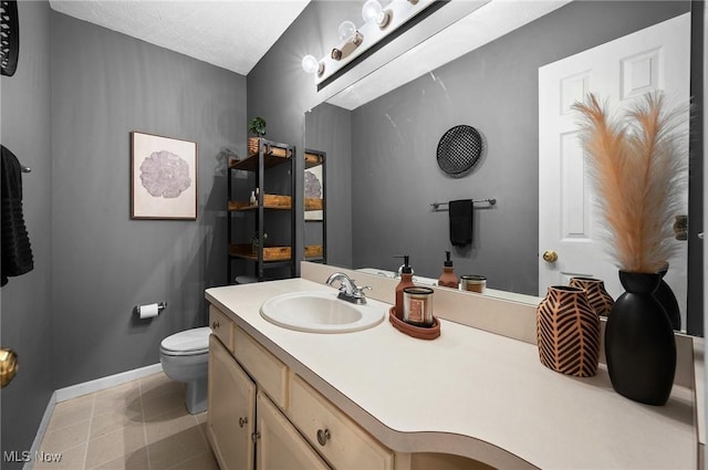 16538 S White Oaks Dr, Strongsville, OH 44136 - half bathroom with baseboards, toilet, vanity, and tile patterned floors