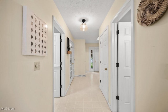 16538 S White Oaks Dr, Strongsville, OH 44136 - hallway with baseboards and light tile patterned floors