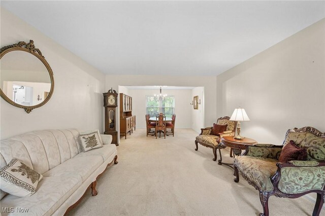 16538 S White Oaks Dr, Strongsville, OH 44136 - living area featuring a chandelier and carpet flooring