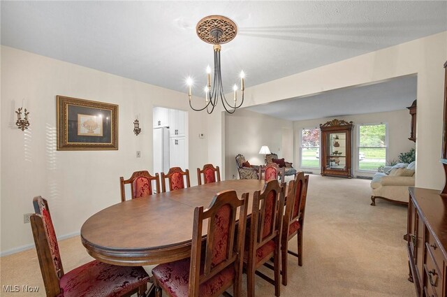 16538 S White Oaks Dr, Strongsville, OH 44136 - dining space with light carpet and a chandelier