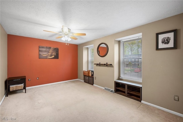 16538 S White Oaks Dr, Strongsville, OH 44136 - empty room with ceiling fan, carpet, baseboards, and a textured ceiling