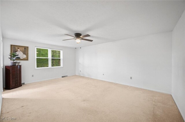16538 S White Oaks Dr, Strongsville, OH 44136 - empty room featuring a ceiling fan, light colored carpet, and baseboards