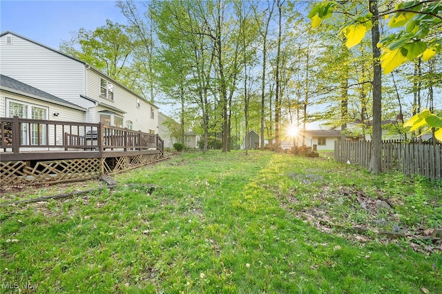 16538 S White Oaks Dr, Strongsville, OH 44136 - view of yard featuring a deck, a storage unit, and an outdoor structure