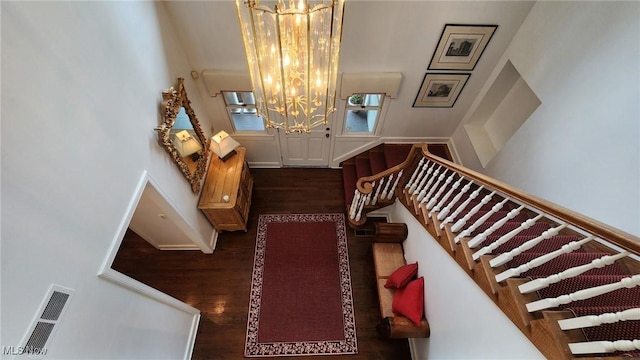 5 W Mather Ln Unit 5, Bratenahl, OH 44108 - stairway with a chandelier, wood finished floors, and baseboards