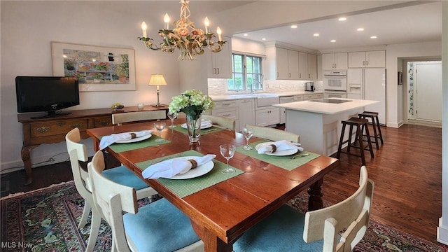 5 W Mather Ln Unit 5, Bratenahl, OH 44108 - dining room with dark wood finished floors, a chandelier, recessed lighting, and baseboards