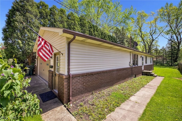 241 W Good Ave, Wadsworth, OH 44281 - view of property exterior with brick siding and a yard