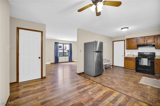 241 W Good Ave, Wadsworth, OH 44281 - kitchen featuring freestanding refrigerator, black range with electric cooktop, under cabinet range hood, dark wood-style flooring, and ceiling fan