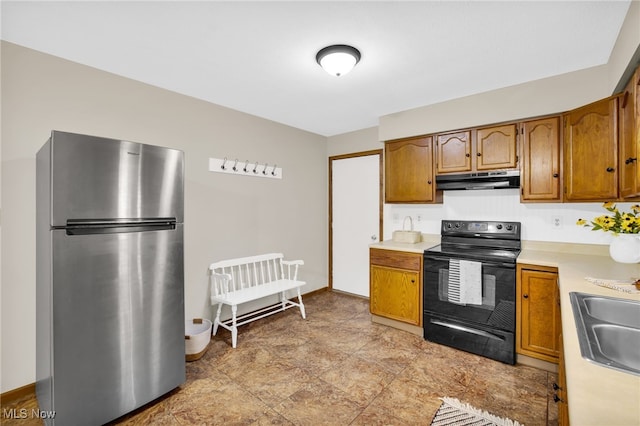 241 W Good Ave, Wadsworth, OH 44281 - kitchen featuring freestanding refrigerator, black electric range, under cabinet range hood, and light countertops